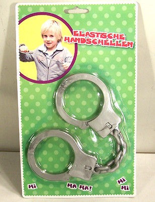 TRICK MAGIC RUBBER HANDCUFF toy keys joke gag fun NEW play wrist 