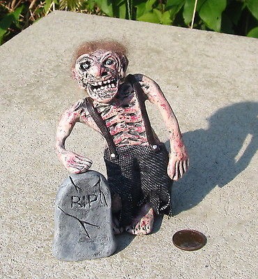 miniature dollhouse fleshy zombie with tombstone from canada time left