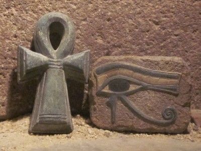 Egyptian Art   Eye of Horus and Ankh amulet. Ancient Egypt carving 