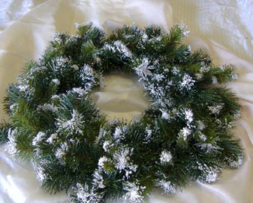 are bidding on one artificial pine Fake snow tipped Wreath. The wreath