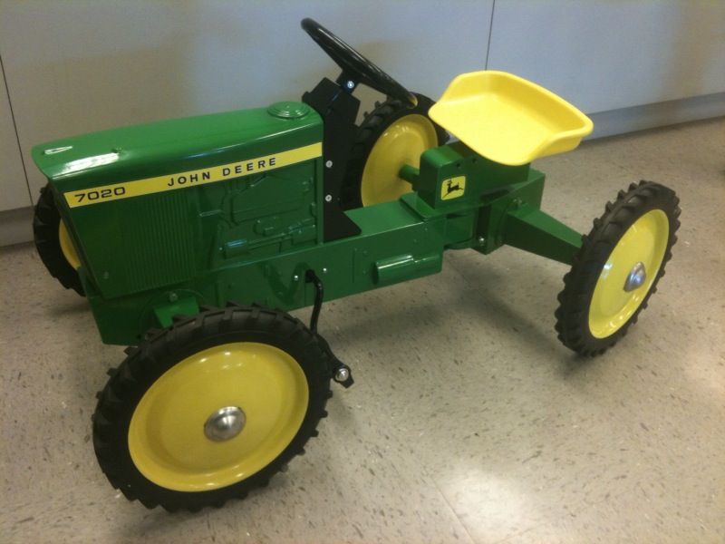 This unique fully functional pedal tractor drives by the front wheels