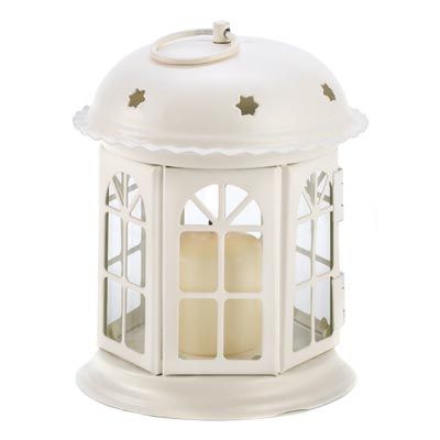 Gracious miniature gazebo lantern shines with golden light through its