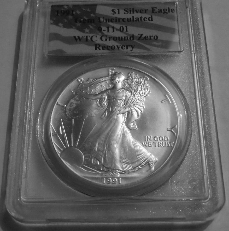 1991 $1.00 SILVER EAGLE WTC GROUND ZERO RECOVERY 9 11 01, PCGS GEM