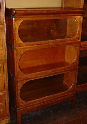 Unusual quartered oak barrister bookcase round windows   THE CANADIAN